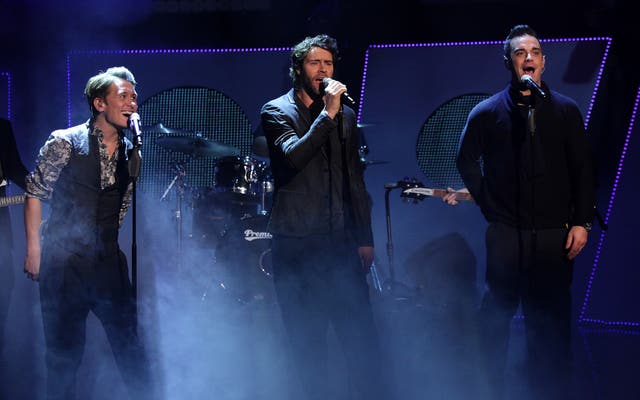 Robbie Williams performing with Take That at the BBC Children In Need Appeal 2010