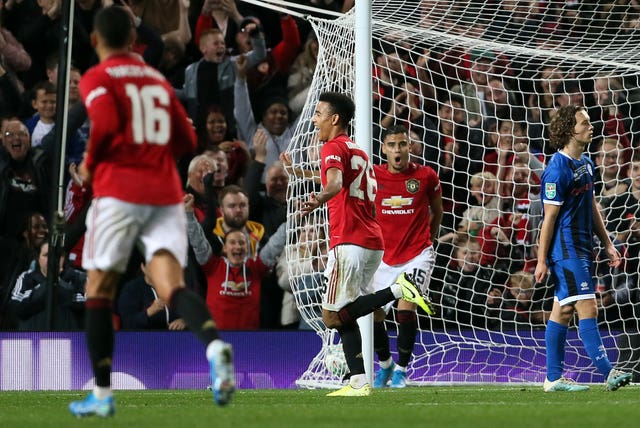 Mason Greenwood, centre left, celebrates scoring against Rochdale