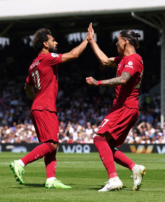 Liverpool’s Darwin Nunez celebrates with Mohamed Salah