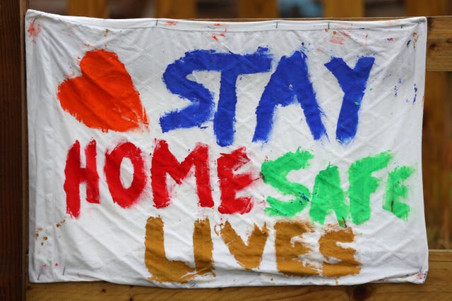 A homemade banner saying ‘Stay Home, Save Lives’ is hung outside The Dragonfly pub in Basingstoke