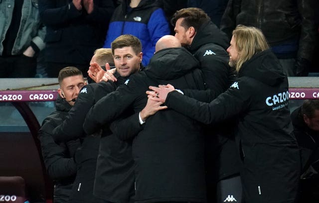 Steven Gerrard, centre left, celebrates victory with his backroom staff