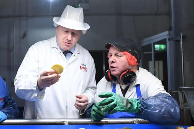 Boris Johnson during a visit to Tayto Castle crisp factory