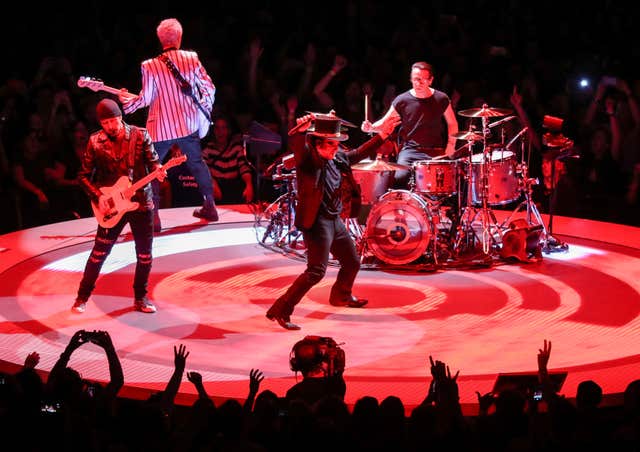 U2 perform on stage