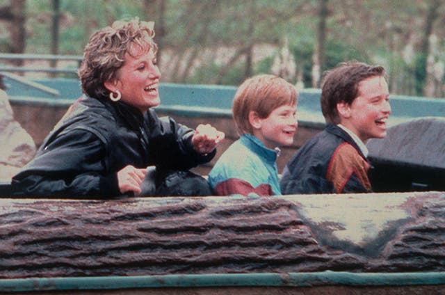 Diana, Princess of Wales enjoys a day out at Thorpe Park amusement park with her sons, Prince Harry (centre) and Prince William