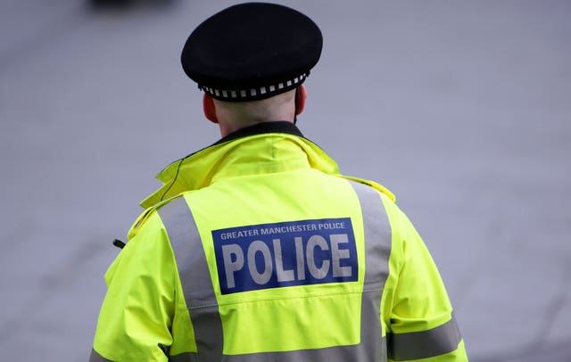 A police officer from Greater Manchester Police on duty in the city centre