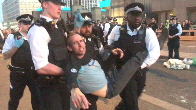 Etienne Stott being arrested on Waterloo Bridge