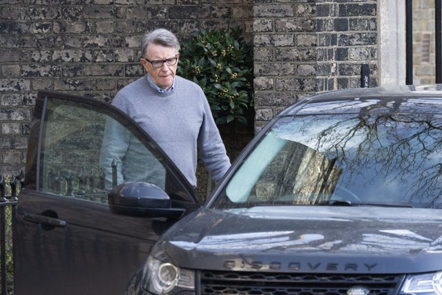 Lord Peter Mandelson leaving his home