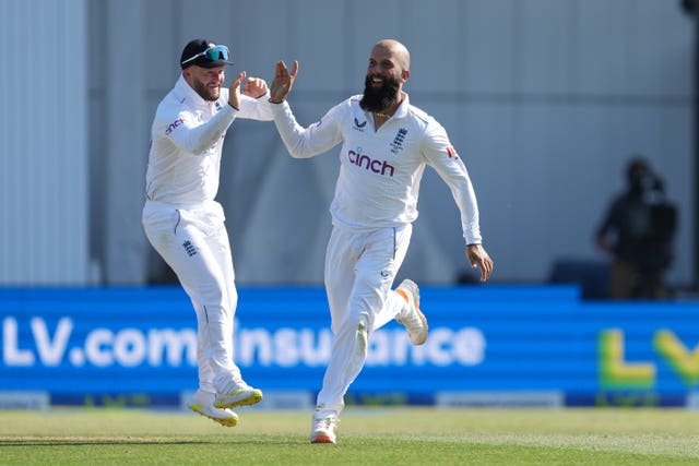 Moeen, right, celebrated his 200th Test wicket on Friday (Danny Lawson/PA)
