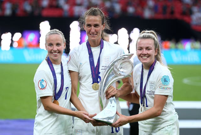 England’s Lauren Hemp (left), Jill Scott (centre) and Beth Mead celebrate with the trophy after England win the UEFA Women’s Euro 2022 final at Wembley Stadium, London. Picture date: Sunday July 31, 2022