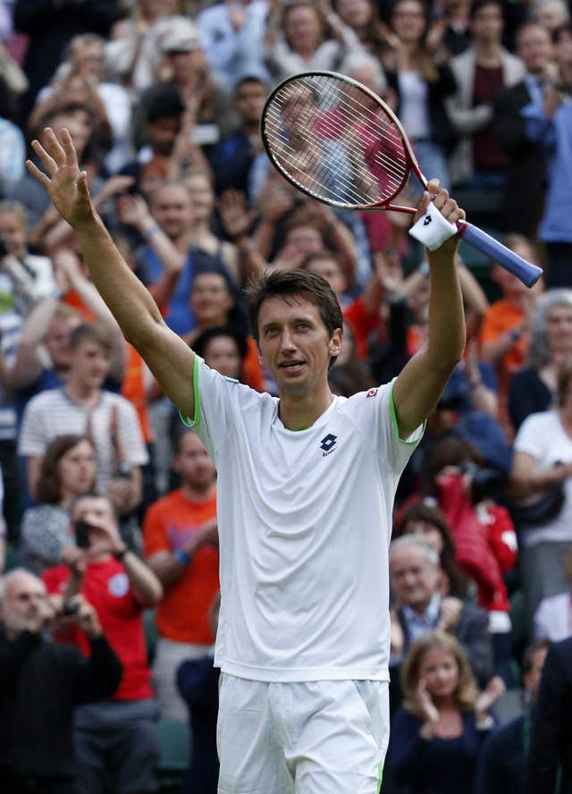 Sergiy Stakhovsky celebrates victory over Roger Federer