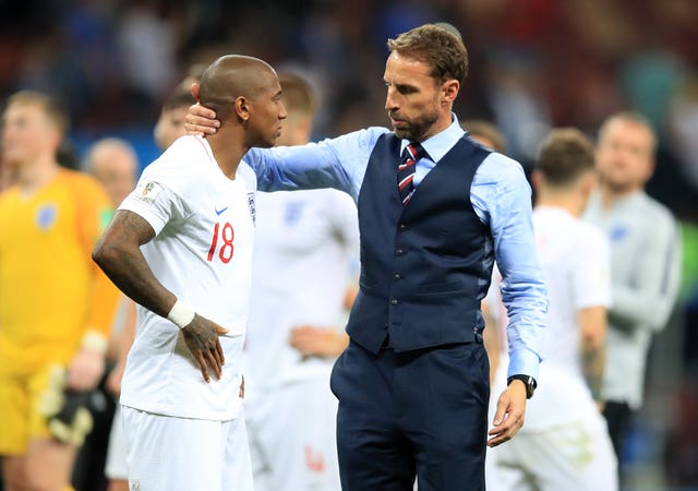 Gareth Southgate consoles Ashley Young after World Cup semi-final defeat.