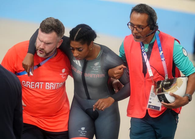 Great Britain’s Kadeena Cox is helped from the track (Adam Davy/PA)