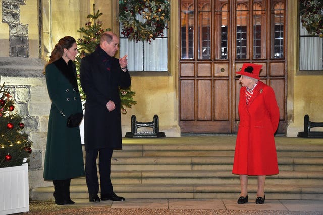 The Queen talks to the Duke and Duchess of Cambridge in the quadrangle at Windsor Castle 
