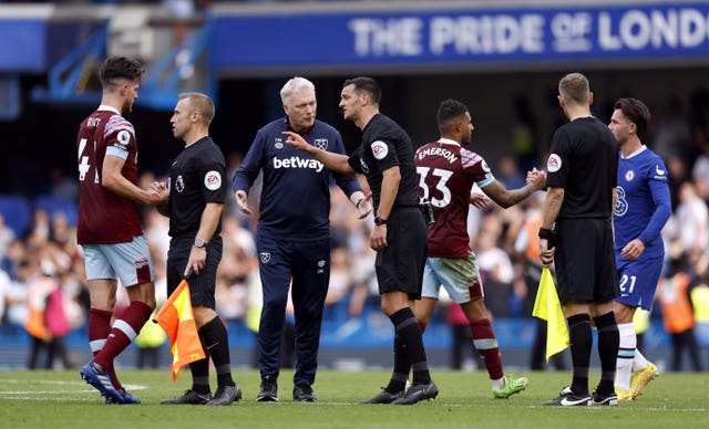West Ham manager David Moyes and midfielder Declan Rice speak to Madley and his officials after the decision to disallow Maxwel Cornet's late equaliser
