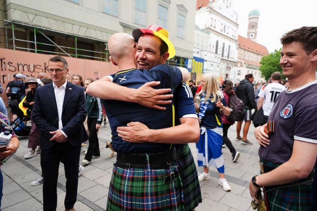 John Swinney hugs a Scotland fan