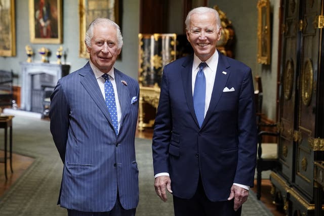 The King and with then-US President Joe Biden in the Grand Corridor at Windsor Castle in 2023
