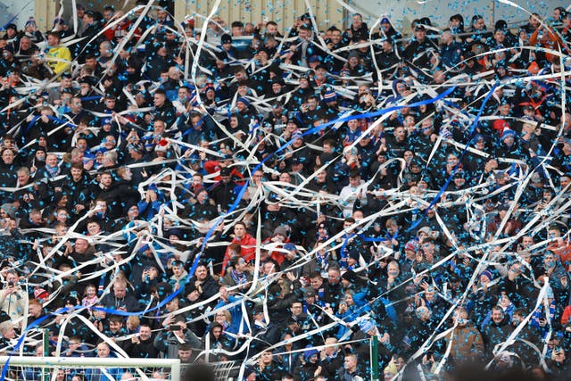 Rangers fans throw confetti during Sunday's 2-0 Premiership win at Motherwell, which lifted them to within two points of leaders Celtic with a game in hand 
