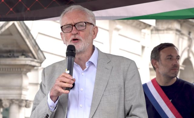 Jeremy Corbyn speaking into a microphone at the Nakba Day protest march