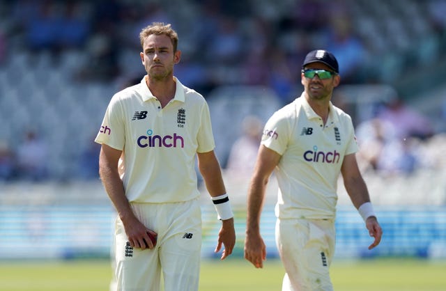 Stuart Broad (left) walks through the outfield with James Anderson