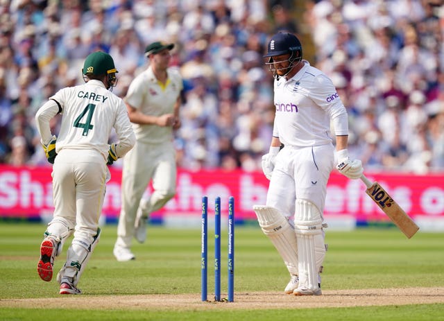 England’s Jonny Bairstow (right) walks after being stumped out by Australia’s Alex Carey