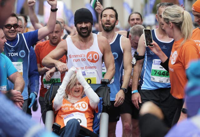 Actor Colin Farrell with his friend Emma Fogarty, running in the Irish Life Dublin Marathon