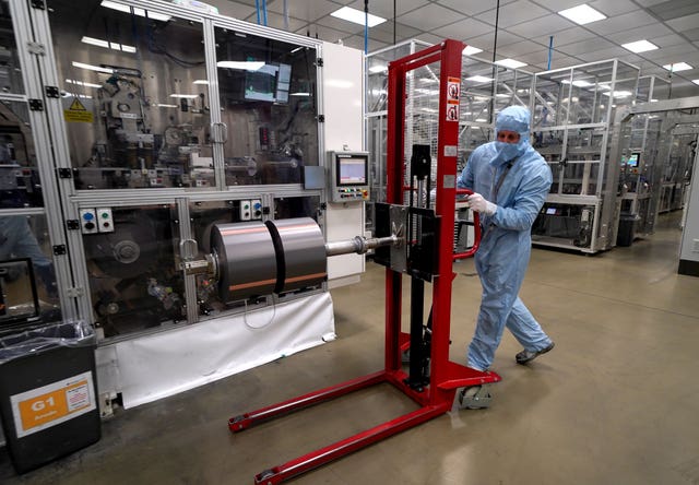 A worker moves components used in the manufacture of the battery for the Nissan Leaf at the Envision AESC UK Ltd battery plant based at Nissan in Sunderland