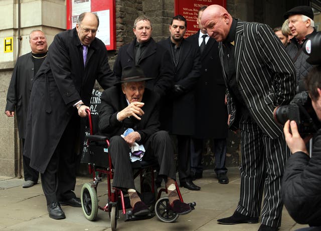 Ronnie Biggs talks with Dave Courtney (right) at the funeral of Bruce Reynolds, the mastermind behind the Great Train Robbery of 1963 at St Bartholomew The Great Church in Smithfield, London.