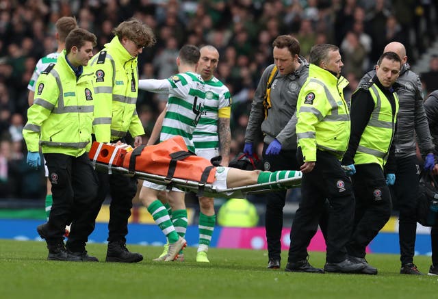 Ryan Christie leaves the field on a stretcher