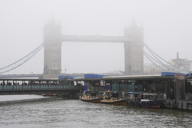 Mist shrouds the tops of Tower Bridge