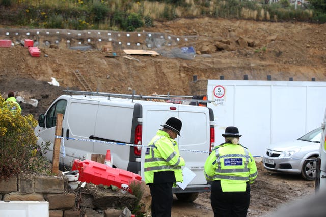 Police officers at the building site