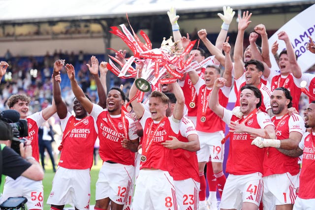 Arsenal captain Martin Odegaard lifts the Premier League trophy