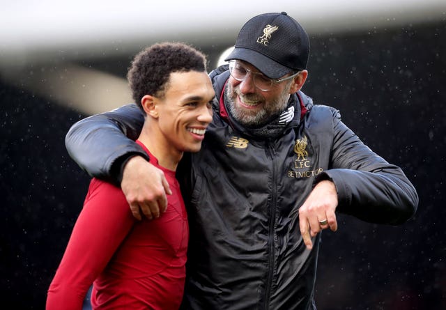 Klopp, right, hugs Trent Alexander-Arnold