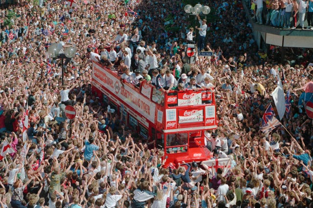 Thousands of fans surround the England team bus in Luton