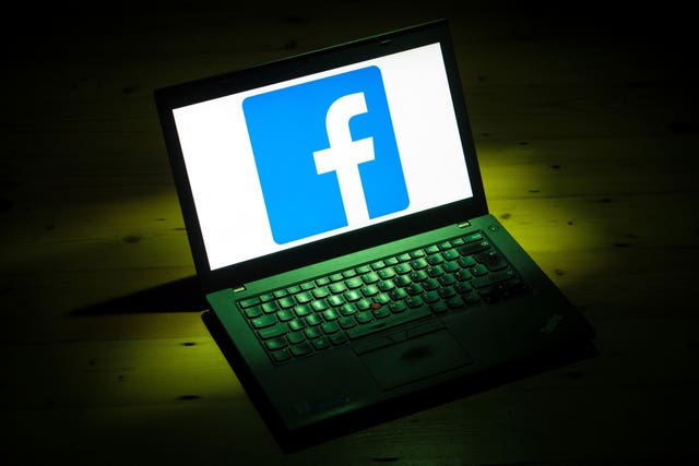 The Facebook logo on a laptop