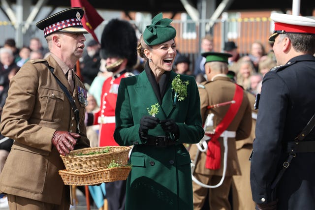Kate hands out shamrock to soldiers