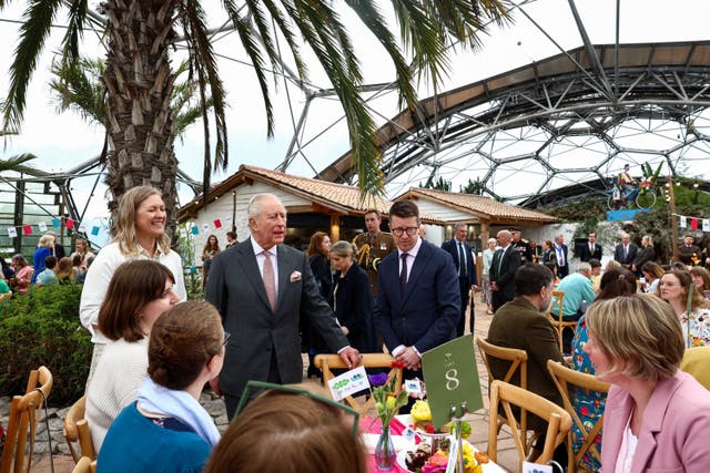 The King among a group of people inside the Eden Project
