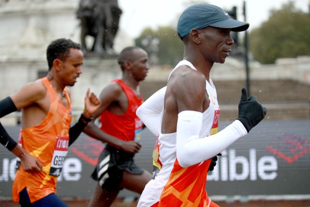 Kipchoge (right) in action during the Men’s Elite Race during the Virgin Money London Marathon around St James’ Park.