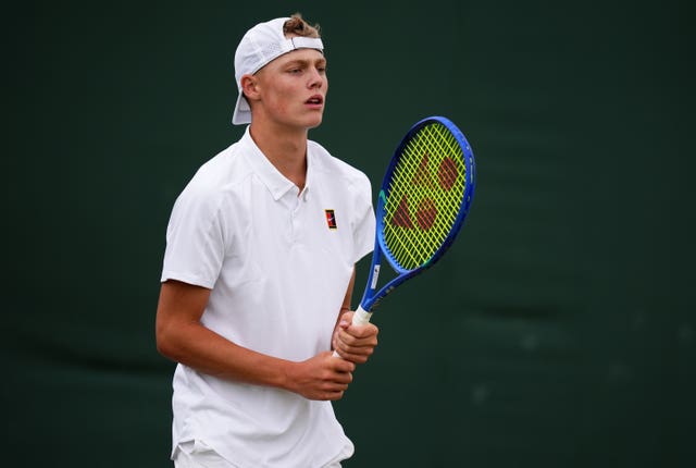 Cruz Hewitt during his boys’ singles match against Savva Rybkin