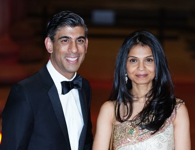 Rishi Sunak alongside his wife Akshata Murty (Ian West/PA)