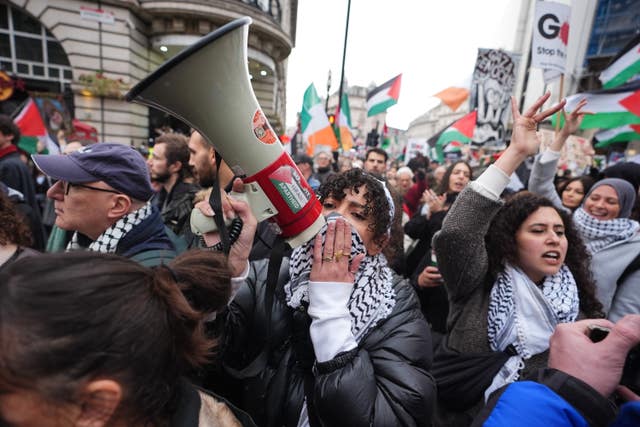 People take part in a Palestine Solidarity Campaign rally in central London