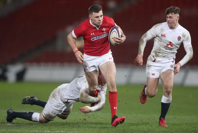 Mason Grady, centre, in action against England Under-20s