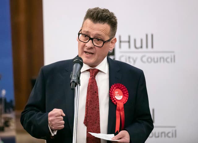 Karl Turner wearing a Labour rosette
