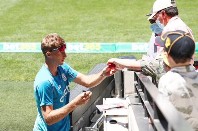 Joe Root signs autographs