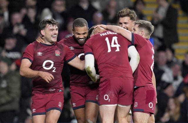 Tommy Freeman is mobbed by team-mates after setting-up George Furbank's try