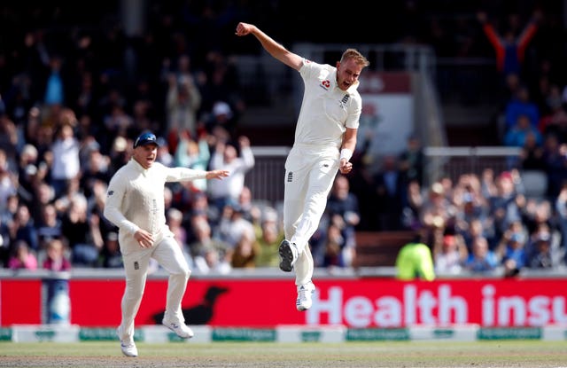 Stuart Broad celebrates taking the wicket of David Warner on Saturday