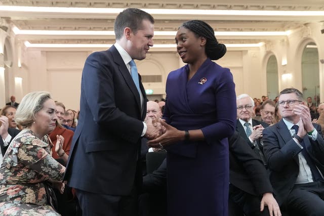 Kemi Badenoch shakes hands with Robert Jenrick after being declared the new Conservative Party leader