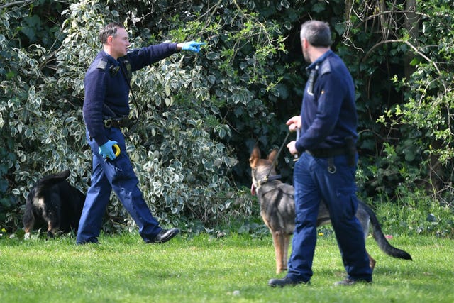 Police and sniffer dogs in Craig Park in north London