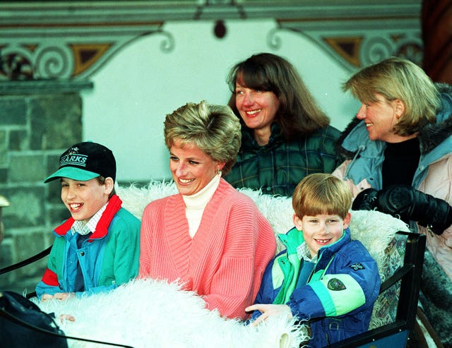 File photo dated 27/03/94 of the Princess of Wales and her two sons, Prince William (left) and Prince Harry, riding in a horse-drawn sleigh as they leave their hotel in Lech, Austria