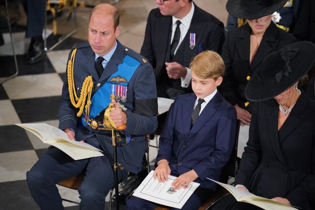 The Prince of Wales, Prince George and the Princess of Wales during the Queen's funeral