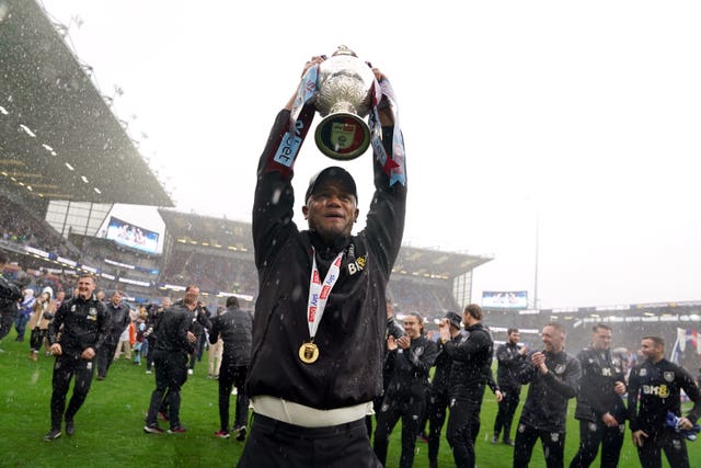 Vincent Kompany lifts the Championship trophy